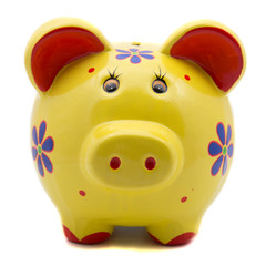 Yellow ceramic piggy bank on white background
