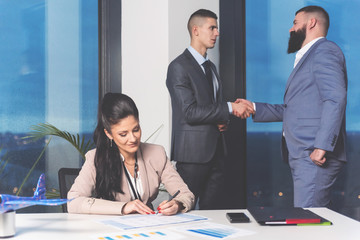 Businesspeople signing contract