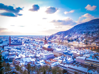 Aerial view of Heidelberg town and Neckar river in winter with snow from the castle in the Baden-Wurttemberg region of southwest Black Forest in Germany during winter Christmas time - obrazy, fototapety, plakaty