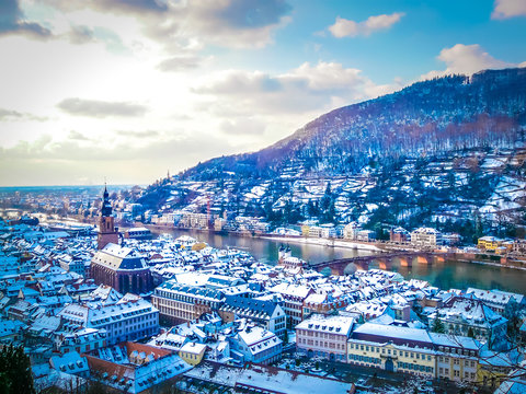 Aerial view of Heidelberg town and Neckar river in winter with snow from the castle in the Baden-Wurttemberg region of southwest Black Forest in Germany during winter Christmas time
