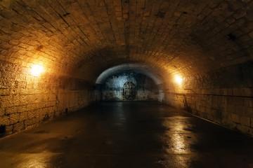 Large empty old dark underground vaulted cellar 