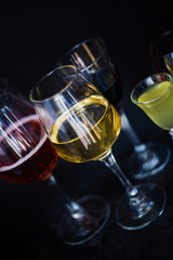 Glassed with drinks on dark background