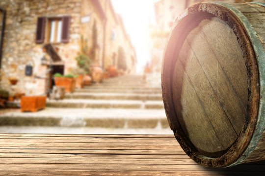 wooden barrel as a table with a free space for an advertising product, the hero on the background of the landscape  
