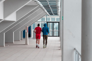 Fototapeta premium two friends runing and practice in the hall