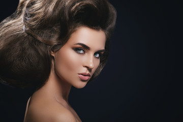 Gorgeous woman with a beautiful hairstyle and make-up