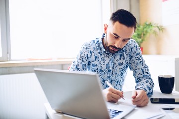 Caucasian businessman working on laptop computer