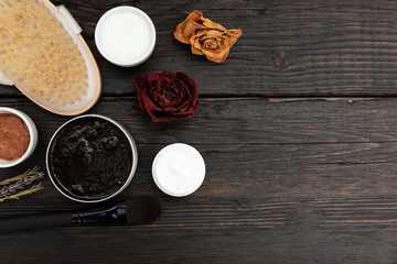 Aromatic botanical cosmetics. Dried herbs flowers mixture, aromatic homemade scrub paste made from coffee grounds and oils. Holistic herbal DIY skincare beauty hack. 