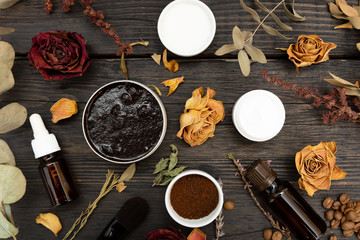 Aromatic botanical cosmetics. Dried herbs flowers mixture, aromatic homemade scrub paste made from coffee grounds and oils. Holistic herbal DIY skincare beauty hack. 