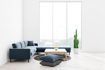 White living room, blue sofa, window