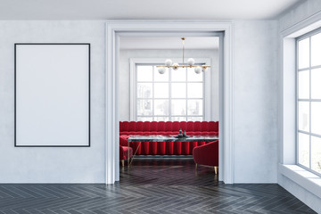 White living room, red sofa and poster