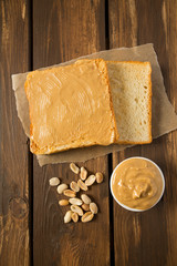 Peanut butter sandwich on wooden surface