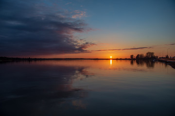 beautiful. red sunset over the sea, lake with clear sky