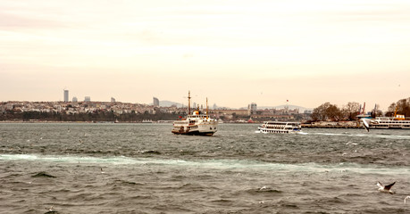 Fototapeta premium Beautiful View touristic landmarks from sea voyage on Bosphorus. turkish steamboats, view on Golden Horn.