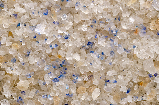 Persian Blue Salt crystals closeup, surface and background. Fine rock salt from Iran. Blue color occurs during forming the crystalline structure, caused by an optical illusion. Seasoning. Macro photo.
