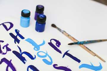 Calligraphy lettering alphabet drawn with dry brush. Letters of English ABC written with paint brush