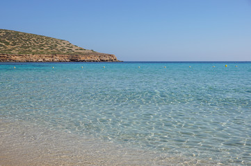 Beautiful sandy Cala Comte beach with azure blue sea water, Ibiza island, Spain