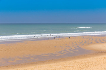Ocean beach on the Atlantic coast of France near Lacanau-Ocean, Bordeaux, France. Windy and cloudy summer day