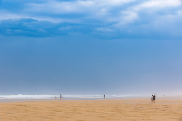 Ocean beach on the Atlantic coast of France near Lacanau-Ocean, Bordeaux, France. Windy and cloudy summer day