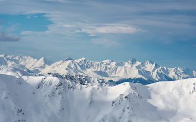 Fototapeta premium Hochfuegen, Zillertal, Tirol / Austria - January 08, 2018: a view of the beautiful Alpine peaks covered in snow, in the direction of Zugspitze, winter landscape