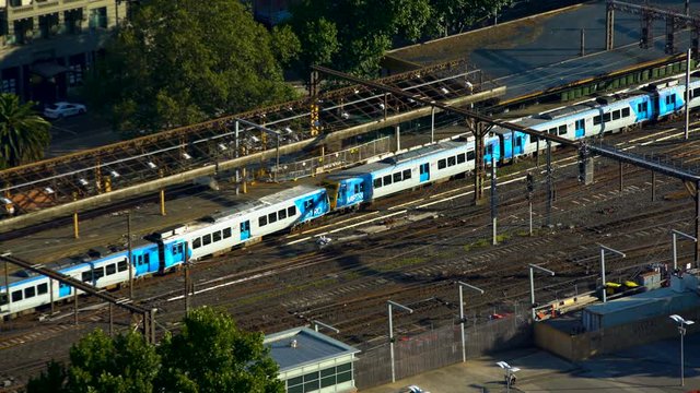 Passenger train leaving Flinders Street Station Melbourne Australia