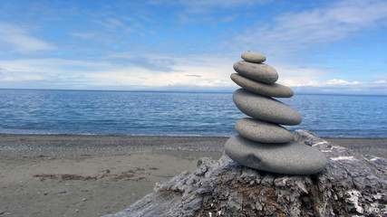 Fototapeta premium Zen rocks on the beach and driftwood