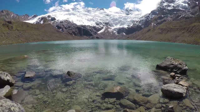 Beautiful cochagrande lagoon at the foot of the snowcapped cochas in the Huaytapallana mountain range.