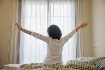 Lady wake up stretch oneself lazily for fresh morning - health care concept