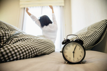 Lady wake up stretch oneself lazily for fresh morning - health care concept