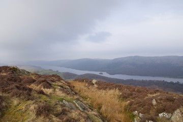 Misty Coniston Water: lake in English Lake District from mountain moor