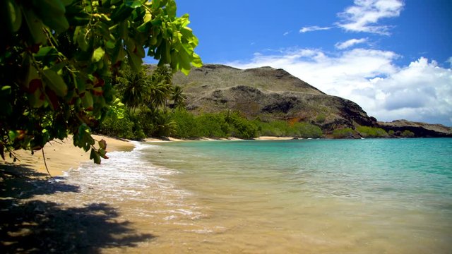 Deserted ocean beach lush vegetation Tahuata Marquesas Pacific