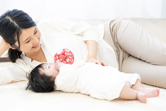 portrait of young mother and baby relaxing