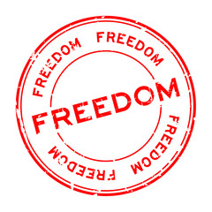 Grunge red freedom round rubber seal stamp on white background