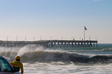 Ventura California Pier during super tide in winter on bright day