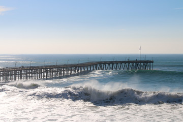 Fototapeta na wymiar Ventura California Pier during super tide in winter on bright day