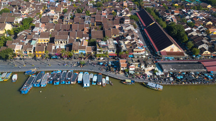 Fototapeta na wymiar Panorama of Hoian market. Aerial view of Hoi An old town or Hoian ancient town in sunny day. Royalty high-quality free stock photo image top view of Hoai river and boat traffic in Hoi An market