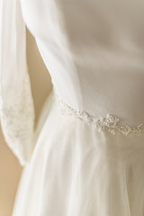 Detail of beautiful wedding dress, premiered valentines day.