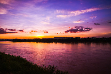 Fototapeta na wymiar Sunset River / Beautiful landscape dramatic sky purple and yellow at Mekong River