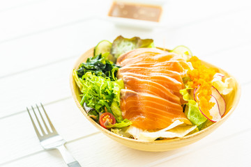 Raw fresh salmon fish meat sashimi with seaweed and other vegetables salad