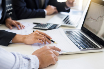 Business Team trader or broker Investment Entrepreneur colleagues working discussing and analysis graph stock market trading with forex chart data, financial, selling and buying concept