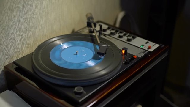 Retro Turntable Playing Blue Vinyl Record