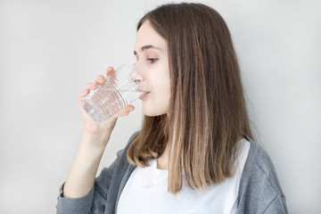 Young woman drinking water 