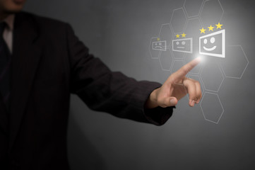 Businessman giving rating with happy icon, Customer satisfaction survey concept