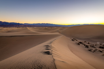 Fototapeta na wymiar Sunrise over the Mesquite Flat Sand Dunes