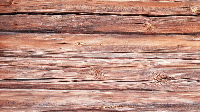 Old dark log. Background of cracked logs.  