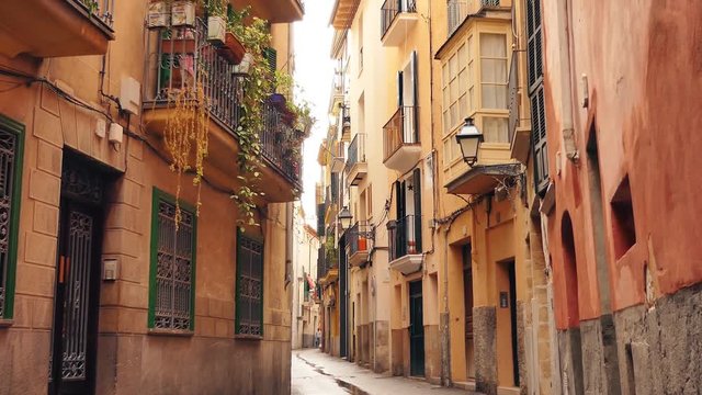 An old narrow street with traditional houses in Spain.