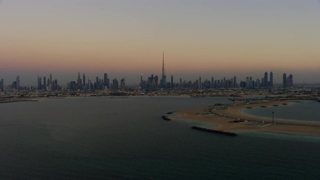 Aerial sunset shoreline view Daria Island city Skyscrapers