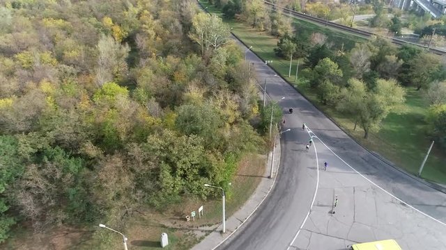 Filming of running athletes along the road next to the rails from the top on the half marathon in Zaporizhia 8