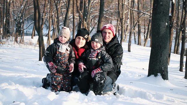 Happy family in winter park. Joy and festive christmas mood.