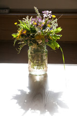 wild flowers in glass jar