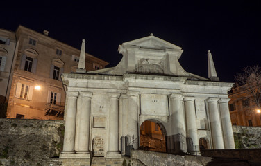 Obraz premium Bergamo, Italy. The old town. Landscape at the old gate Porta San Giacomo during the night. Venetian walls of Bergamo